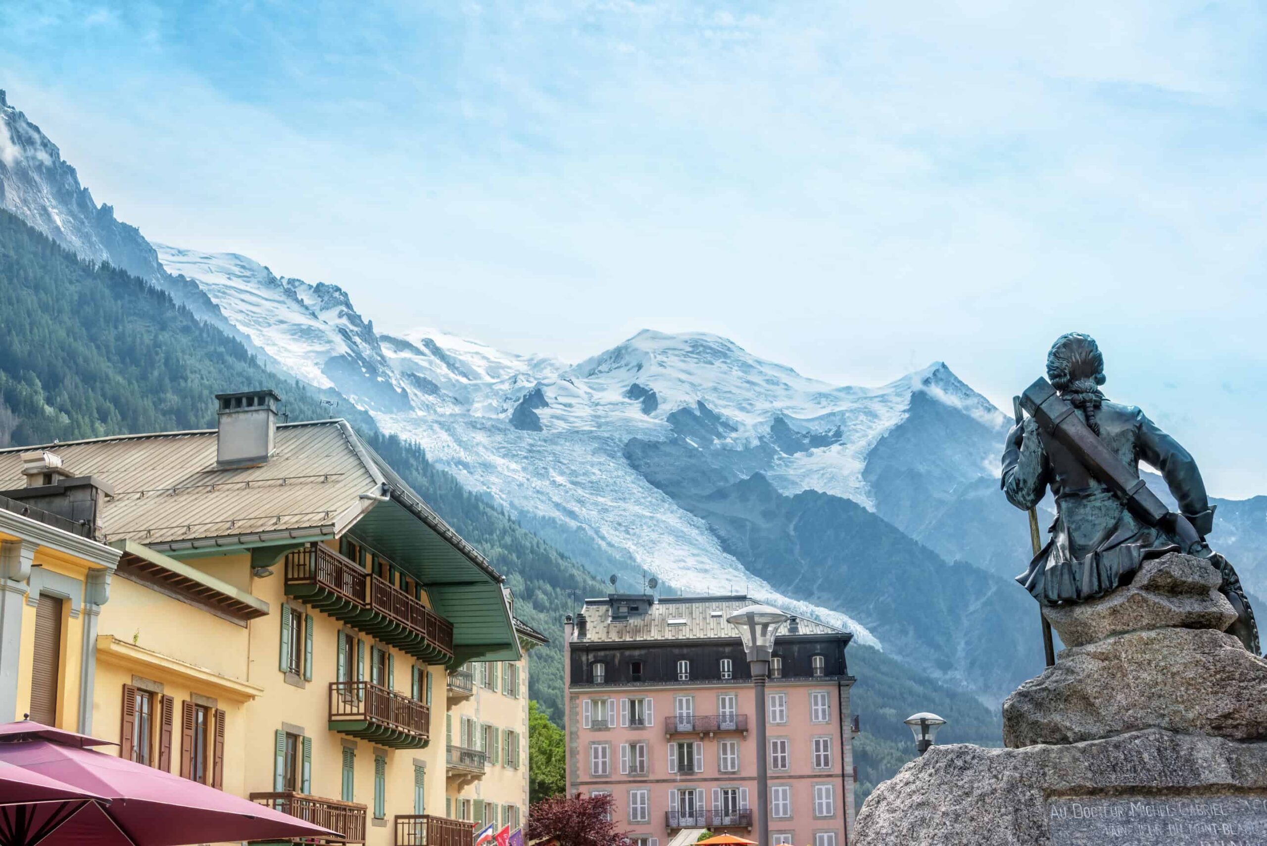 The town of Chamonix, the Mont blanc summit with the Bossons glacier in the background, The Alps, France